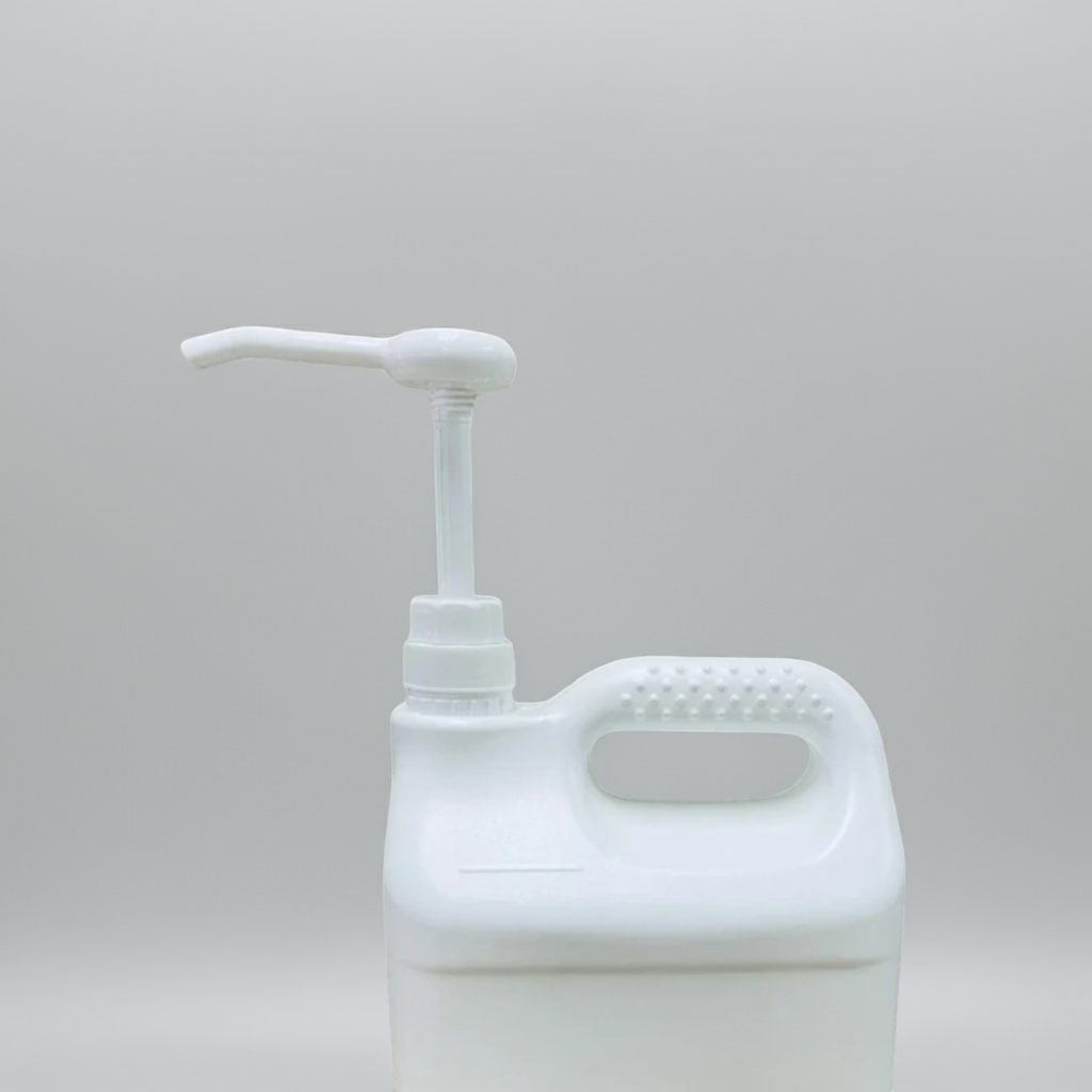 White plastic bottle with pump on a light gray background