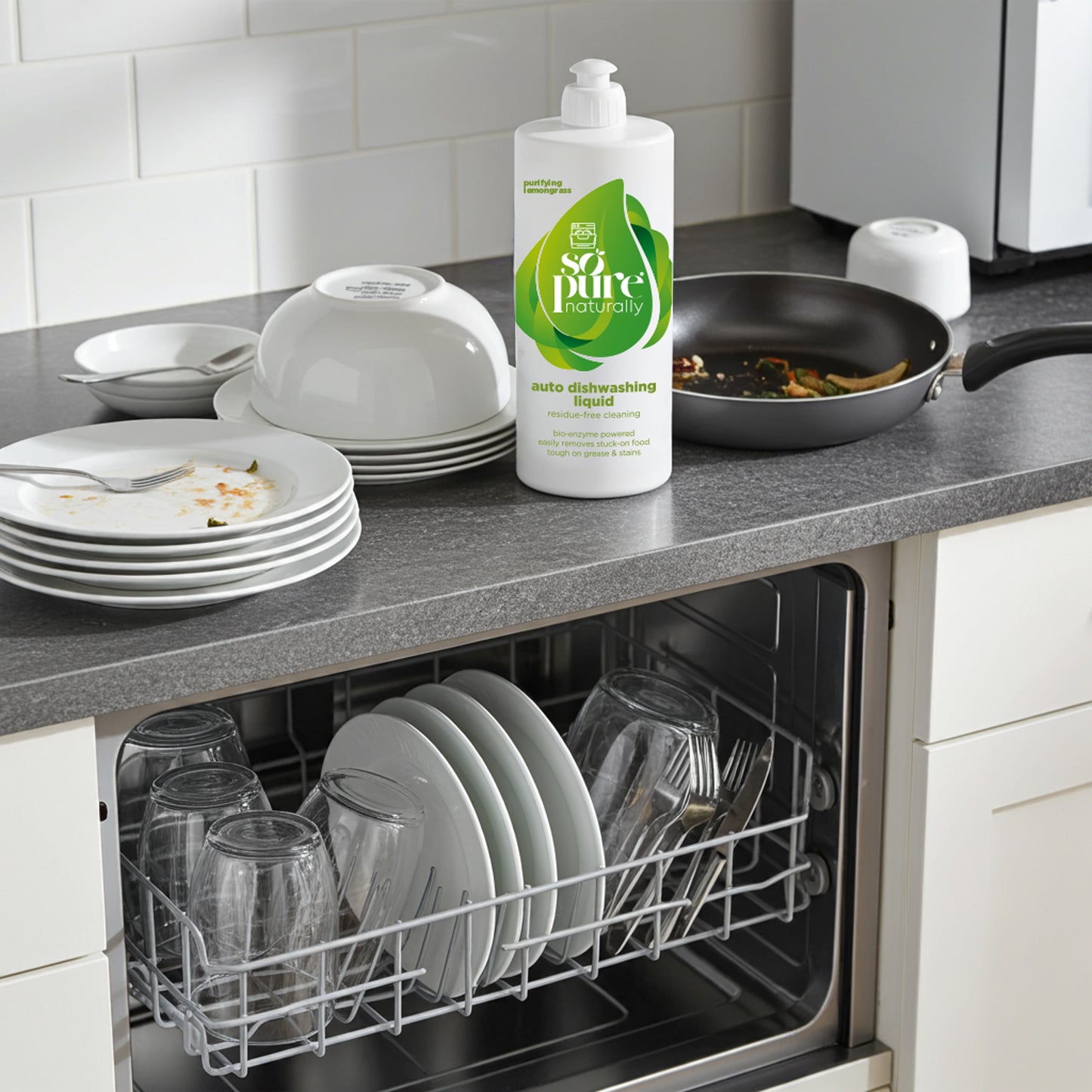 Dishwasher with clean dishes and a bottle of So Pure dishwashing liquid on a kitchen counter.