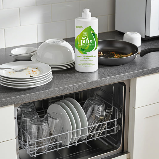Dishwasher with clean dishes and a bottle of So Pure dishwashing liquid on a kitchen counter.